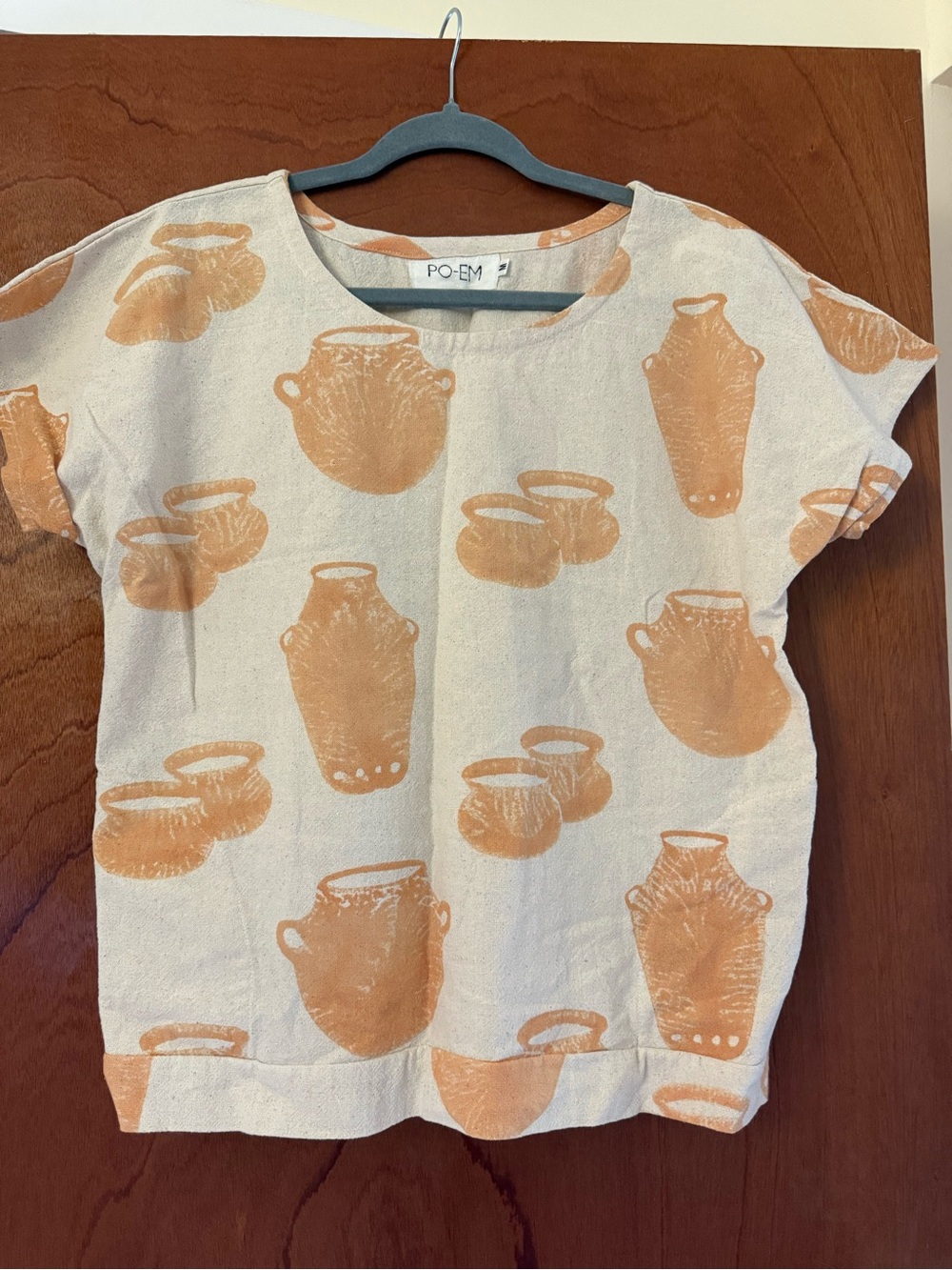Girls' Cream Top with Orange Pottery Print